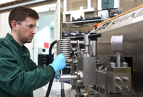 Scientist using equipment to provide enzyme supply