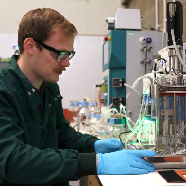 Scientist using analytical equipment to evaluate a sample